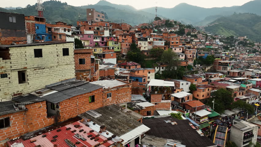 Colorful poverty homes in Favela Comuna 13, in Mendellin, Colombia - Aerial view