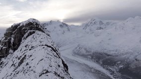 Swiss aerial footage. Lauterbrunnen's cascading waterfalls, Murren's scenic charm, to Zurmatt’s matterhorn mountain, 4K drone of Swiss Alps, alpine meadows, and deep valleys and snow-capped peaks.