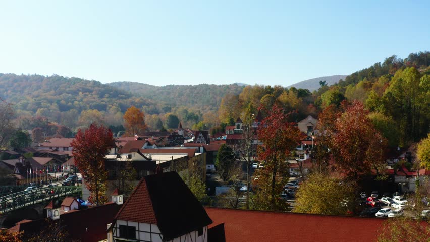 Slowly rising above the Fall colors in alpine village of Helen Georgia