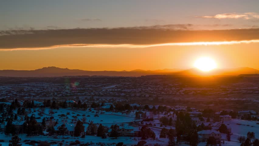 Sunset over snowy hills, winter landscape, aerial, Parker, Colorado, 4K