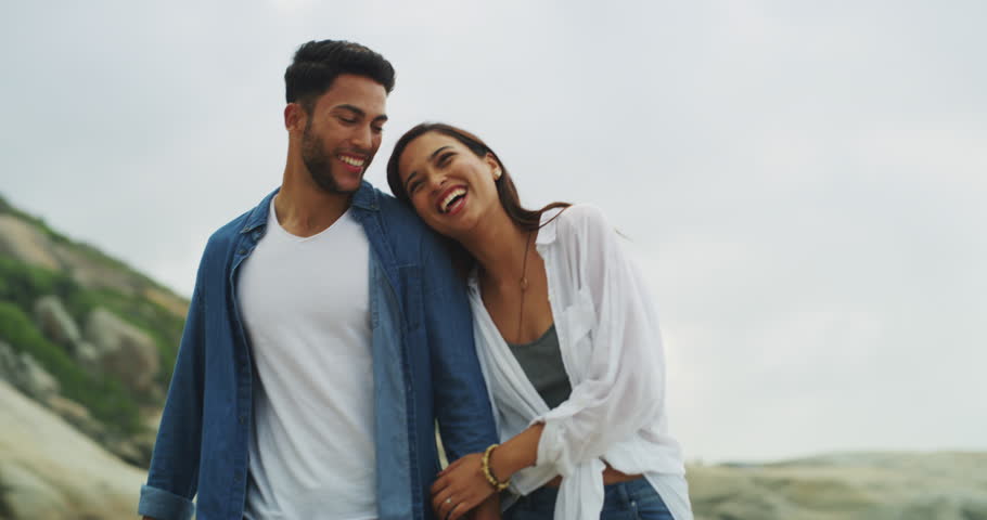 Holding hands, beach and couple with love, holiday and relax with tropical island, getaway trip or marriage. Honeymoon, man or woman with adventure, date or commitment with relationship and ocean