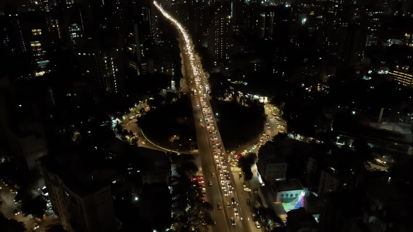 Beautiful top view of car traffic at roundabout lane and buildings. Aerial view of Mumbai. Urban cityscape concept or abstract of advanced innovation, financial technology, and energy power