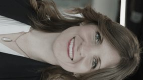Close up panning shot of confident smiling businesswoman - vertical video, pleasant grove, utah, united states