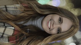 Portrait of happy woman smiling at camera outdoors near christmas trees - vertical video, provo, utah, united states - Powered by Shutterstock - Get 15% off with code: PIKWIZARD15