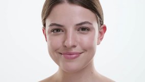 Portrait of a Woman Applying Mascara on White Background - Powered by Shutterstock - Get 15% off with code: PIKWIZARD15