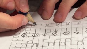 child writes in copybooks, close-up 4K video. High quality 4k footage