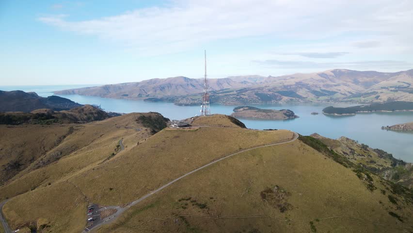Sugarloaf Hill communication tower and Port Hills aerial landscape. New Zealand