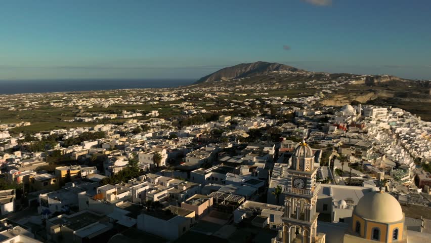 
Drone view of Santorini in Greece, an island in the Cyclades. View of the magnificent white houses of Fira and Oia with their large cliffs