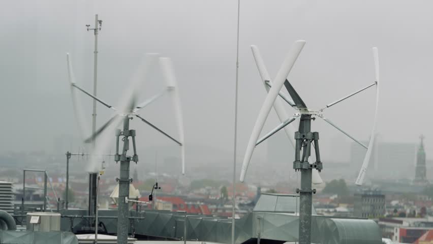 Vertical-axis wind turbine generating renewable energy on a rooftop  Royalty-Free Stock Footage #1111305591