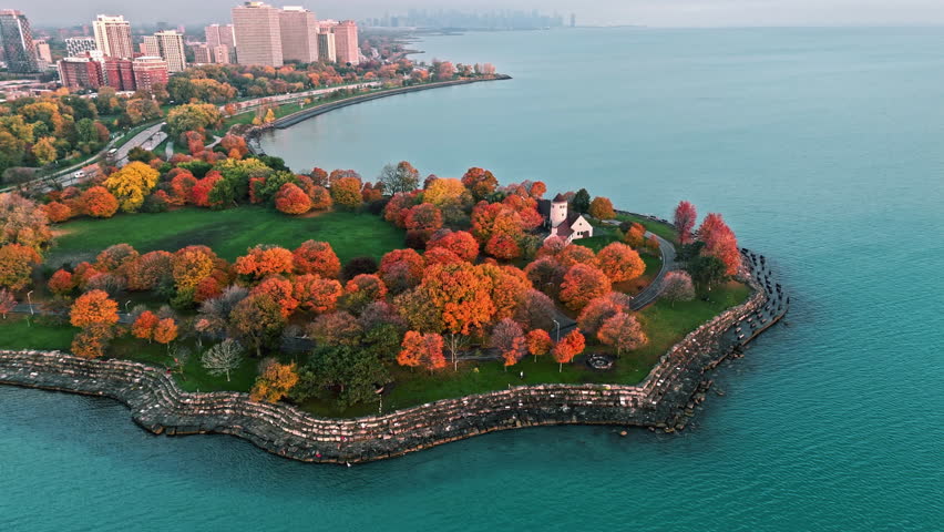 Aerial tracking shot of fall foliage at the Promontory Point of Chicago, USA