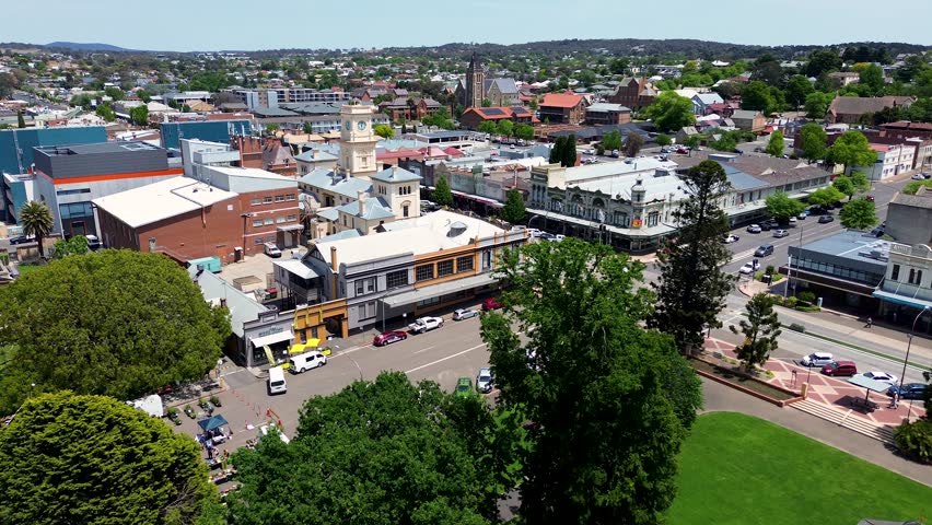 Drone aerial pan shot of Goulburn main town regional CBD location town travel tourism streets road cars Goulburn Southern Tablelands rural NSW Australia 4K