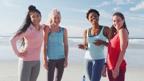 Animation of social media icons over group of diverse fit women smiling together at the beach. Yoga, meditation and social media networking technology concept - Powered by Shutterstock - Get 15% off with code: PIKWIZARD15