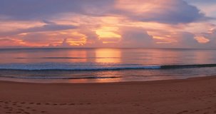 Nature beach sunset background.Tropical sea at sunset or sunrise over sea video 4K, The sun touches horizon,Colorful sky in golden hour amazing seascape,Ocean beach sunsets beautiful sky