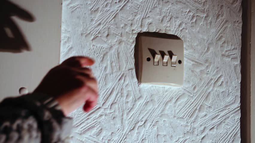  Turning on old vintage toggle light switch medium zoom shot selective focus