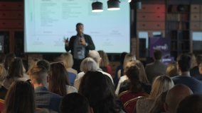 Back view of diverse business professionals attending presentation in projection room at export forum - Powered by Shutterstock - Get 15% off with code: PIKWIZARD15