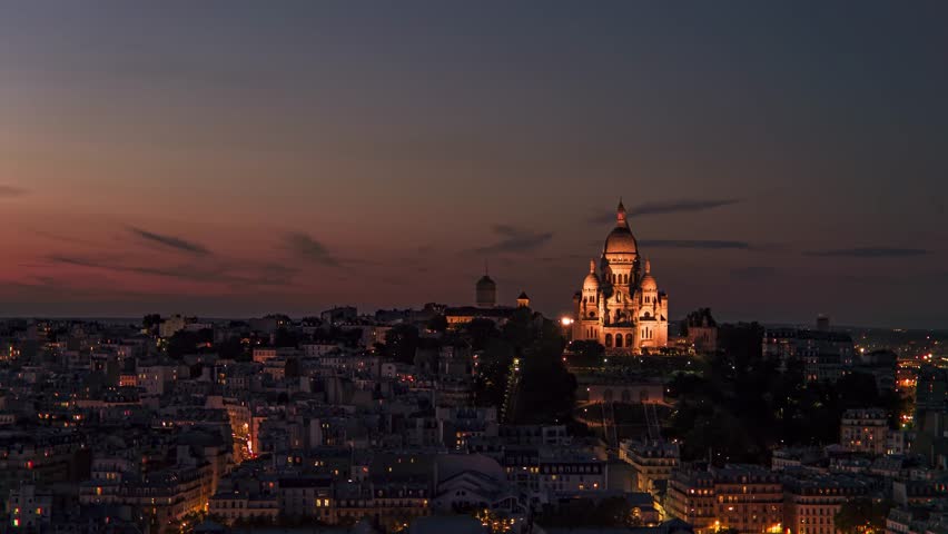 Establishing aerial view of Paris Sacre-Coeur and Montmartre hill at night. Panoramic view of Paris city illuminated at night Royalty-Free Stock Footage #1111349153