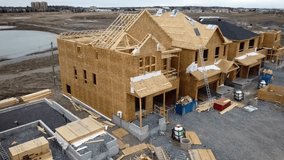 Drone Footage of New Houses under Construction, Aerial Drone footage of New home construction in a urban boundary, various model homes under construction during a new phase of expansion, 4k Video