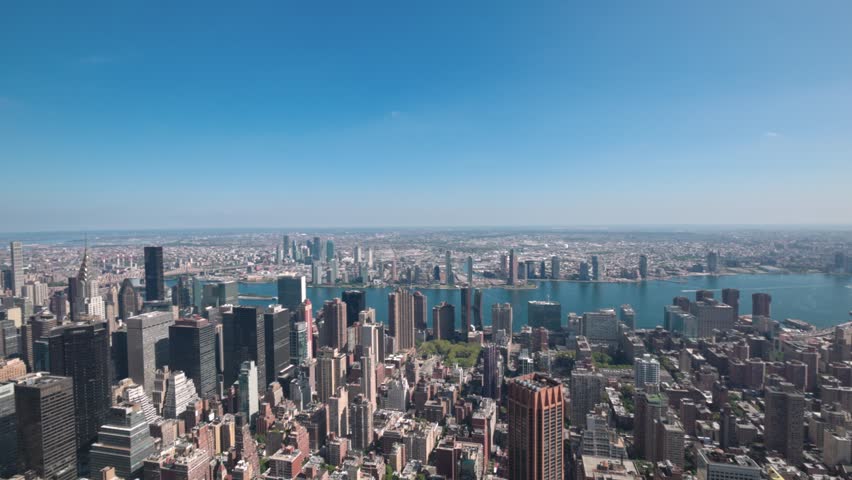 Aerial view of Manhattan skyline with skyscrapers Hudson River on sunny day. | Shutterstock HD Video #1111353417
