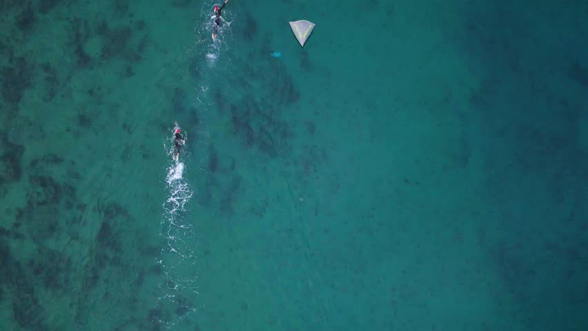 People swim at a triathlon race in sea aerial view 4K. Royalty-Free Stock Footage #1111365163