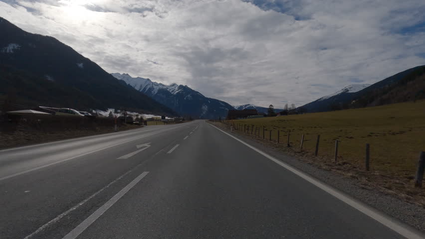 POV FRONT VIEW DRIVING PLATE car driving on winter roads in Austrian Alps | Shutterstock HD Video #1111372289