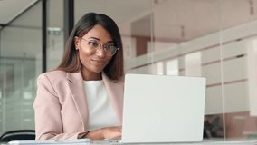 Busy professional business woman employee working looking at computer typing in office. Young African American female company finance sales manager executive using laptop sitting at desk. - Powered by Shutterstock - Get 15% off with code: PIKWIZARD15
