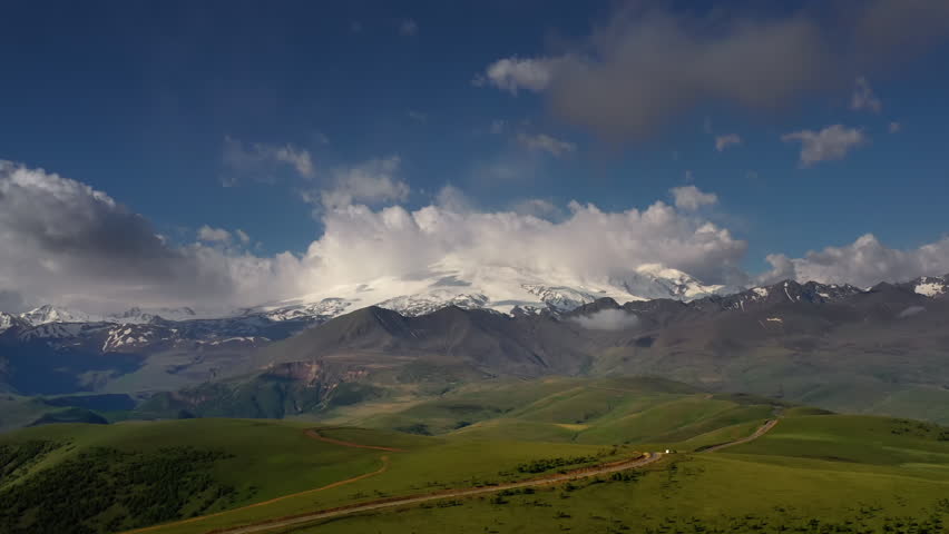Elbrus Region. Flying over a highland plateau. Beautiful landscape of nature. Mount Elbrus is visible in the background. | Shutterstock HD Video #1111378871