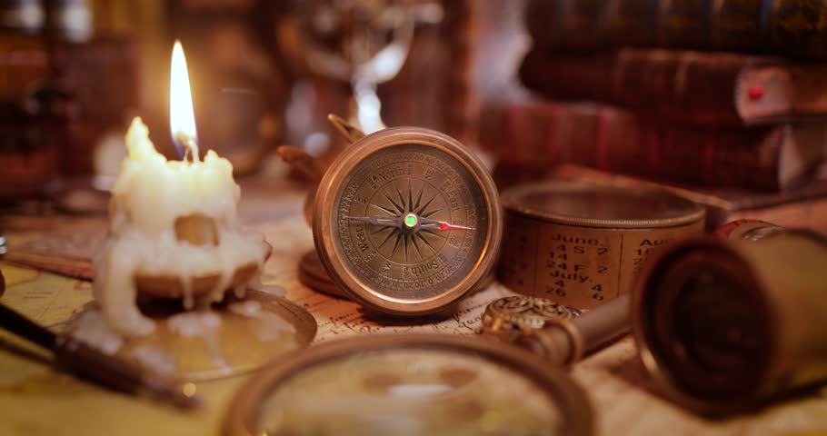 Vintage style travel and adventure. Vintage old compass and other vintage items on the table. | Shutterstock HD Video #1111378949