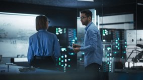 In Technological Research Facility: Portrait of a Team of Two Professional Engineers Using Digital Tablet and White Board to Discuss the Manufacturing Plan for Product Development - Powered by Shutterstock - Get 15% off with code: PIKWIZARD15