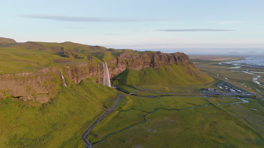 Drone footage of summer beauty of the South region of Iceland with highlands with green grass and majesctic waterfall creating streams all over lowlands. High quality 4k footage Royalty-Free Stock Footage #1111388841
