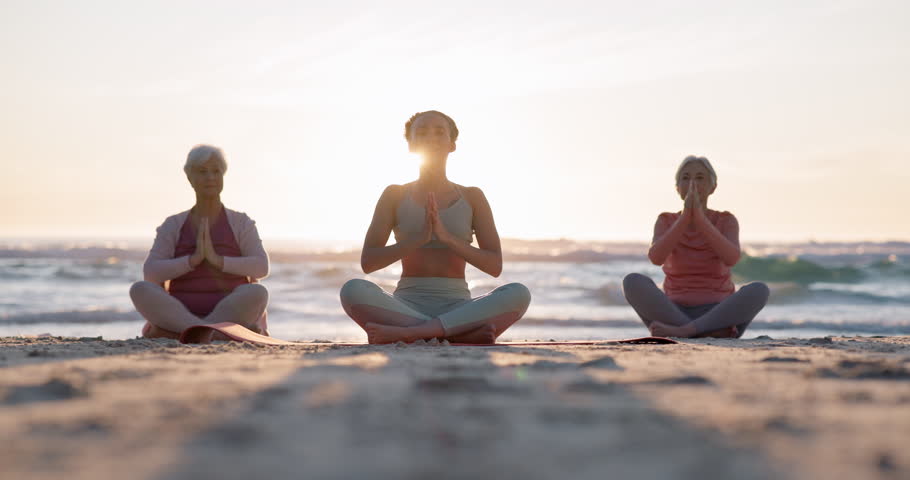 Beach yoga class, sunset and meditation instructor coaching zen mindset, spiritual chakra healing or breathing exercise. Freedom, calm and people learning pilates, training and coach teaching group Royalty-Free Stock Footage #1111389151