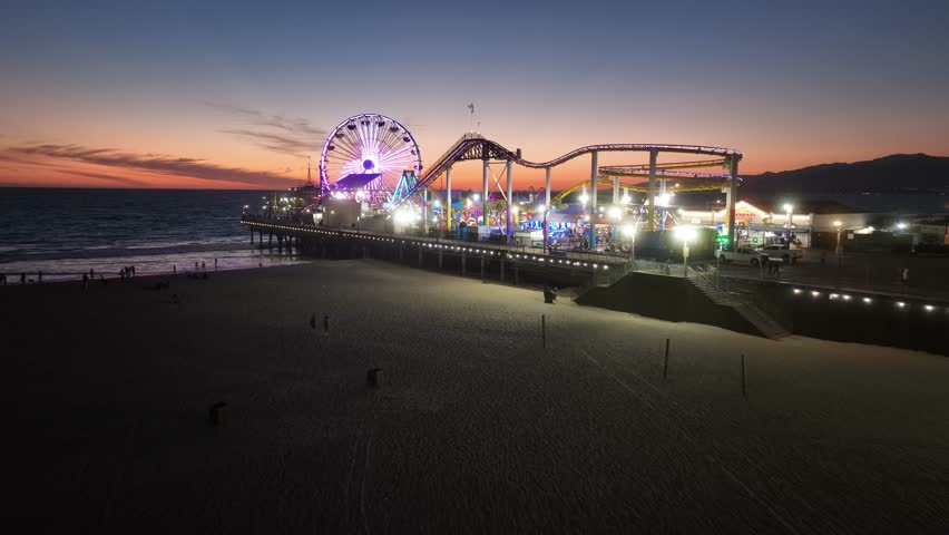 Santa Monica Pier At Los Angeles In California United States. Colored Amusement Park Pier. Ferris Wheel Landscape. Santa Monica Beach At Los Angeles In California United States. Royalty-Free Stock Footage #1111396691