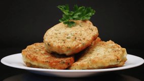 cooked fried potato cutlets with herbs