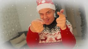 Funny guy dancing and smiling at Christmas party dressed in traditional red sweater with reindeer and Santa Claus cap, New Year holiday background with effect of falling snowflakes. - Powered by Shutterstock - Get 15% off with code: PIKWIZARD15