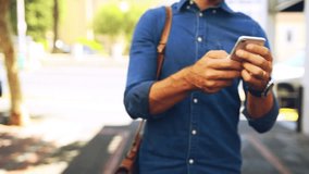 Man, walking to work and text with smartphone, outdoor and building in city, urban and hands. Worker, consultant and reading email for job, creative and tech for notification, mobile app and career - Powered by Shutterstock - Get 15% off with code: PIKWIZARD15