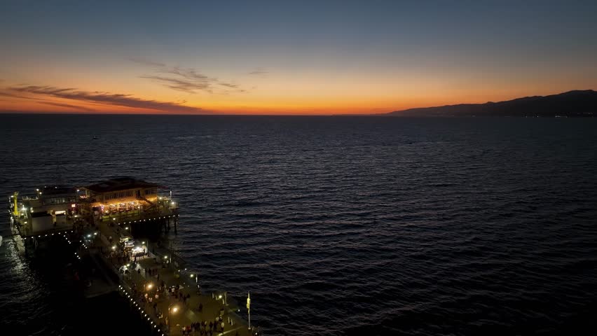 Sunset Skyline in Santa Monica Pier At Los Angeles In California United States. Amusement Park Harbor Scenery. Ferris Wheel Landmark. Santa Monica Pier At Los Angeles In California United States.