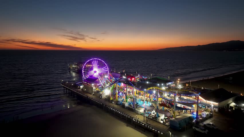 Sunset Skyline in Santa Monica Pier At Los Angeles In California United States. Amusement Park Harbor Scenery. Ferris Wheel Landmark. Santa Monica Pier At Los Angeles In California United States.