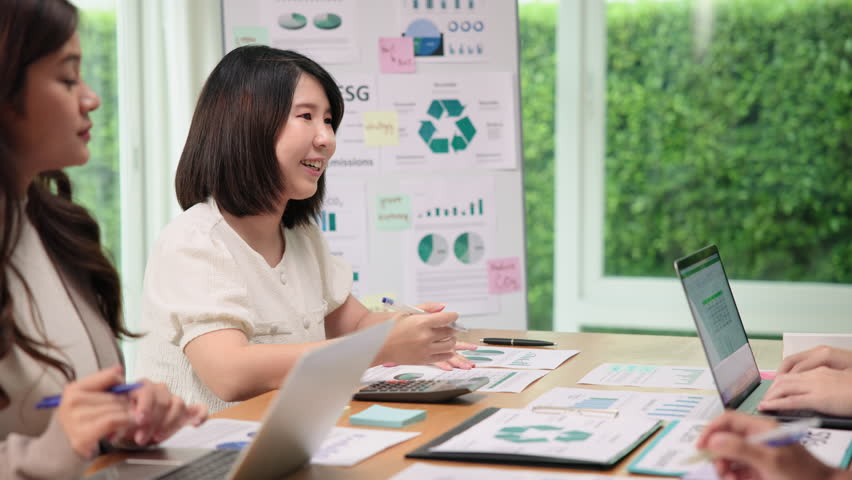 CO2 emission offset price advice control go green report. Net zero waste advisor ESG ethical asian team office meeting talking climate change. Group asia woman people SDGs plan expert social working. | Shutterstock HD Video #1111435857