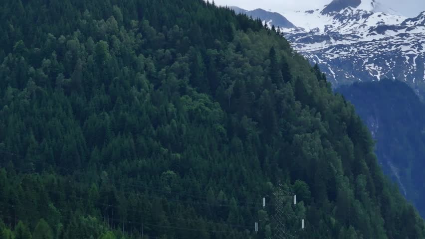 Almost touching heaven, alpine mountain range and beautiful green forest Royalty-Free Stock Footage #1111435991