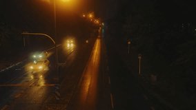 Night road view from the bridge of passing cars and lights of evening lanterns on a rainy autumn day - Powered by Shutterstock - Get 15% off with code: PIKWIZARD15