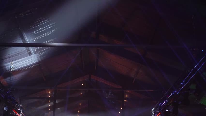 Loft ceiling and lasers under the ceiling during a holiday party | Shutterstock HD Video #1111446535