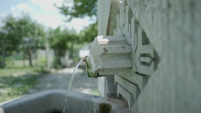 Close-up shot of a thermal mineral spring water source at St. Petka, believed by visitors and pilgrims to possess healing powers to heal the sick, located in Rupite, Petrich, Bulgaria.