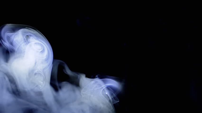 Thick Clouds of Blue Smoke Move in Rays of Neon Light in Empty Black Background. Whirlpool of Puffs of Icy Blue Vapor in Dense Fog. Texture. Abstract. Spin. Blurred motion. Smoking. Cigarette. Waves. | Shutterstock HD Video #1111449381