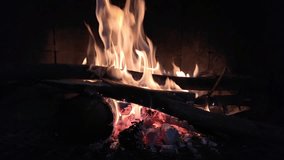  A mesmerizing night scene with flames dancing in a chiminea, evoking winter, Christmas, and spirituality. 4K footage at 120 frames per second, perfect for creating a cozy, introspective ambiance