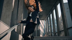 Joyful happy Caucasian young business woman girl worker dancing walking down on stairs outside carefree businesswoman have fun listen music in headphones dance sing in city sunlight celebrate achieve - Powered by Shutterstock - Get 15% off with code: PIKWIZARD15