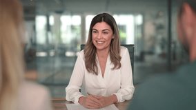 Smiling mature professional business woman banking loan manager, insurance agent, lawyer or financial advisor consulting clients couple sitting at work corporate office meeting. - Powered by Shutterstock - Get 15% off with code: PIKWIZARD15