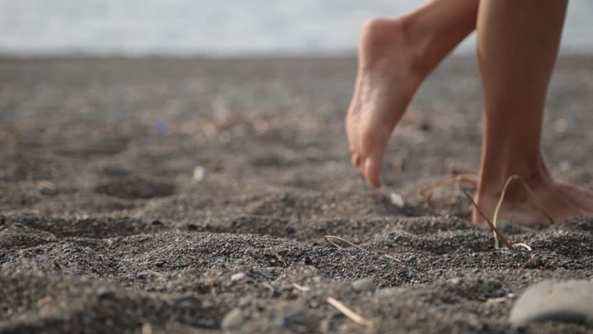 A woman walks barefoot on soft sand. Comfort, coziness and health. | Shutterstock HD Video #1111457533