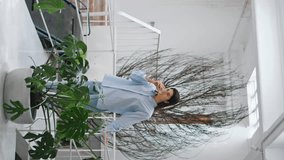 Thoughtful businesswoman drinking water on office break. Business owner taking sip enjoying design store vertical video. Peaceful woman holding tea in art gallery interior. Artist creator in studio. - Powered by Shutterstock - Get 15% off with code: PIKWIZARD15