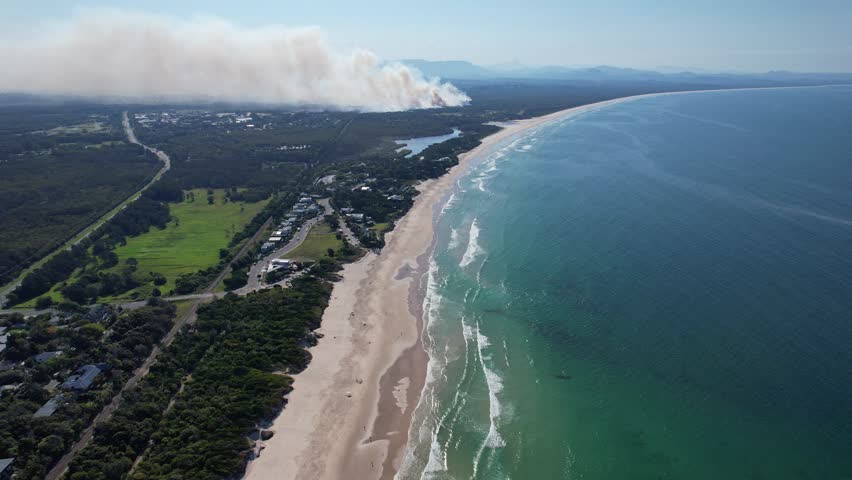Smoke From Burning Coastal Bushland - Bushfire Next To North Belongil Beach in Byron Bay, NSW, Australia. - aerial shot Royalty-Free Stock Footage #1111469925