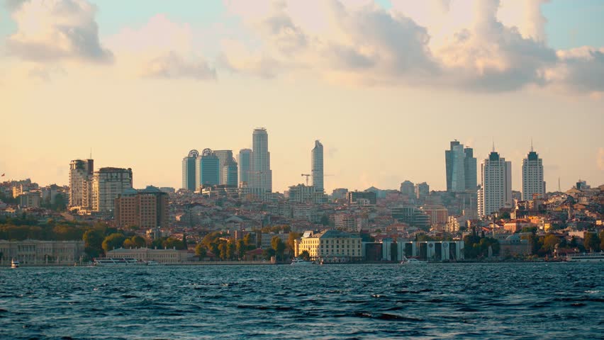 Cityscape in Istanbul, Turkey, towering over city, Istanbul. Beautiful view of historical modern district of Besiktas of Istanbul. Boat trips on Bosphorus. Movement of ships and boats