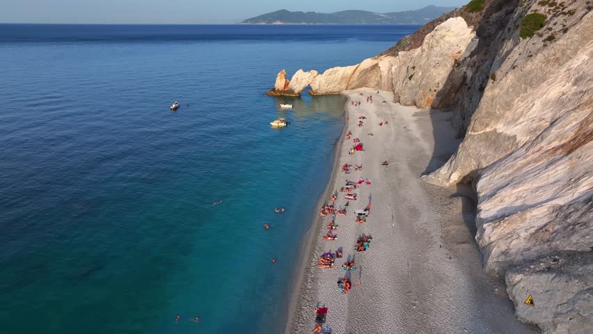 The beautiful beach of Lalaria with shining, turquoise sea during sunset time, Skiathos island, Sporades, Greece